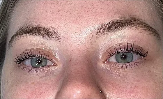 A natural lash lift with defined, tinted brows